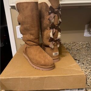 UGG Women's Tan Sheepskin Boots with Bow Accents